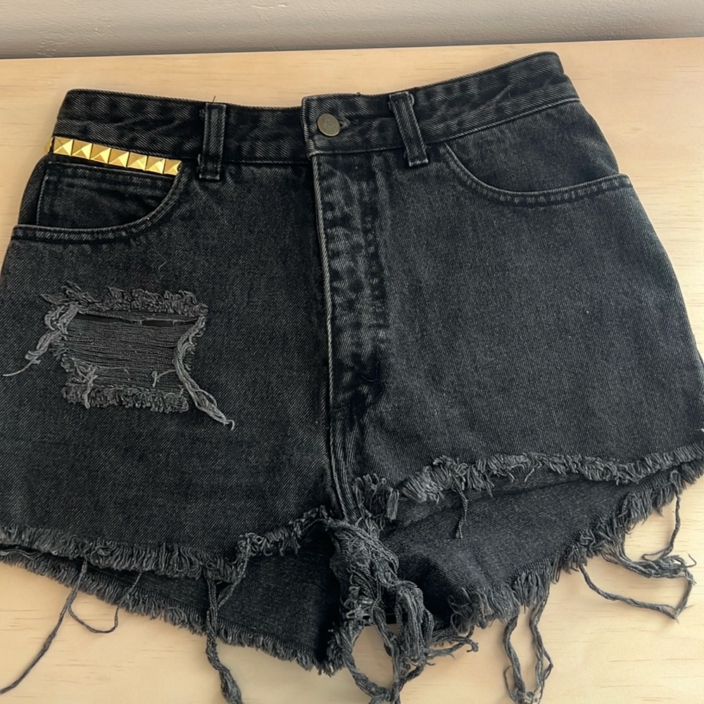 Guess distressed high waisted black denim shorts with gold accents
